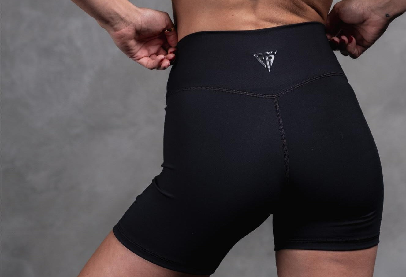 Woman wearing black boxing shorts