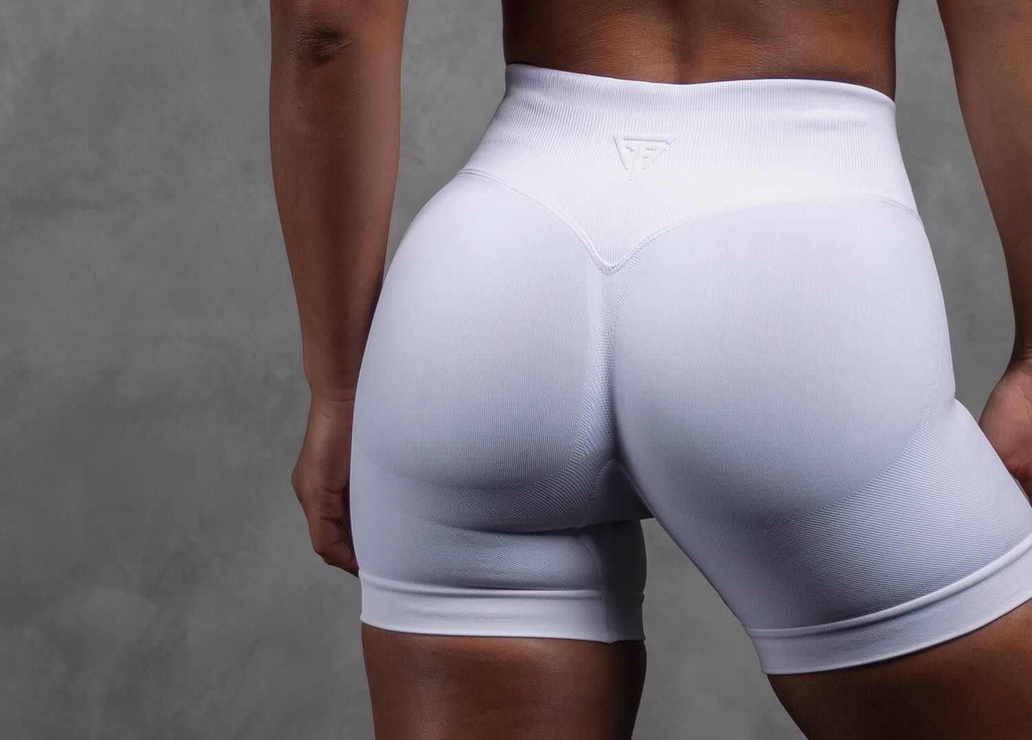 Woman wearing white cross-fit shorts