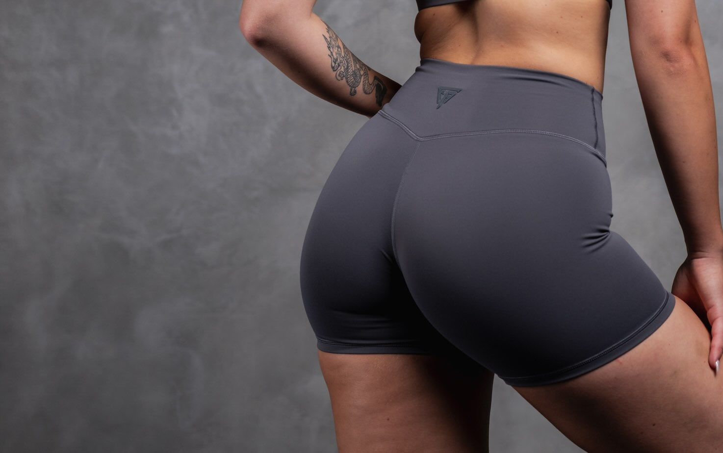 Woman wearing grey high waist shorts
